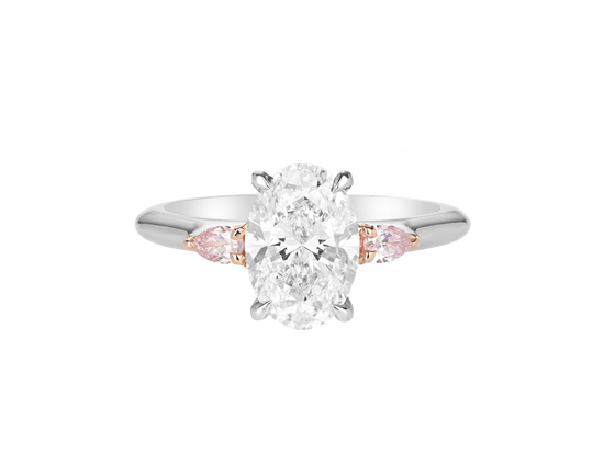 A.G oval cut diamond with pear cut side diamonds in a half round band.