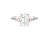 A.G oval cut diamond with pear cut side diamonds in a half round band.