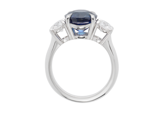 A.G round Royal Blue sapphire and diamond trilogy ring.
