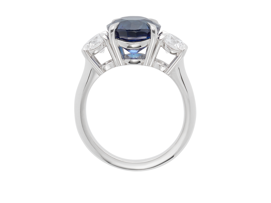 Front view of A.G round Royal Blue sapphire and diamond trilogy ring.