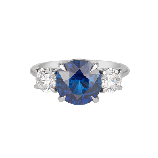 A.G round Royal Blue sapphire and diamond trilogy ring.