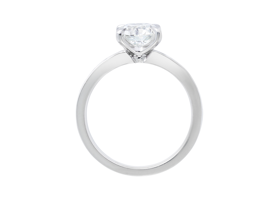 Front view of A.G round brilliant cut diamond four claw setting with channel set diamond band.