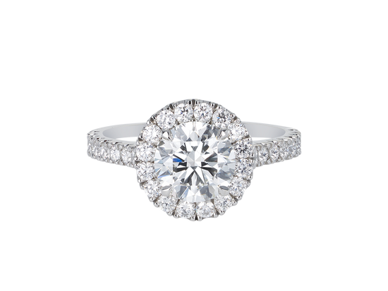 A.G round brilliant cut diamond halo setting with split bead half diamond band.