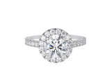 A.G round brilliant cut diamond halo setting with split bead half diamond band.