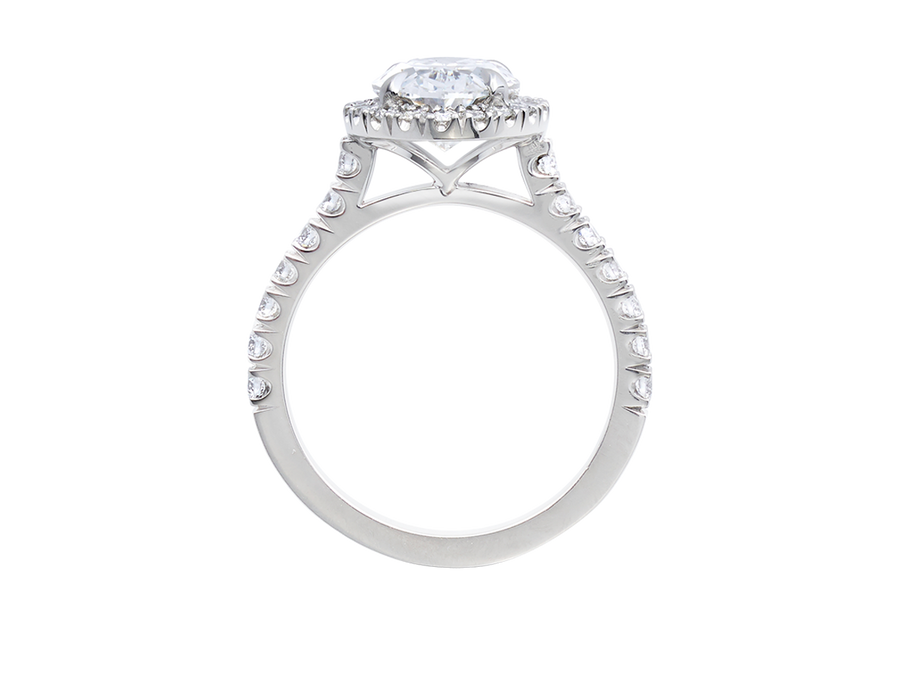 Front view of A.G oval cut diamond halo setting with split bead half diamond band.