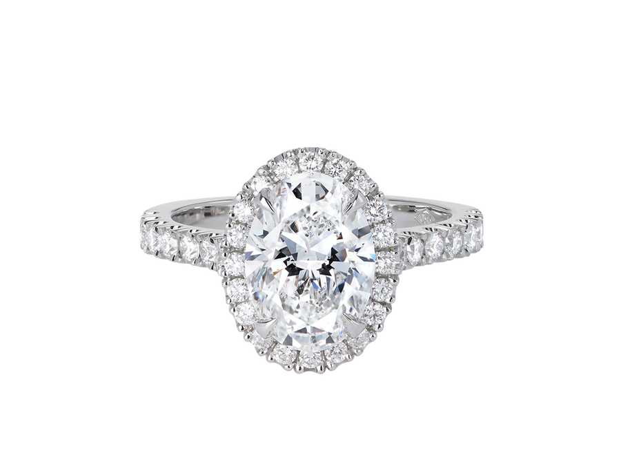 A.G oval cut diamond halo setting with split bead half diamond band.