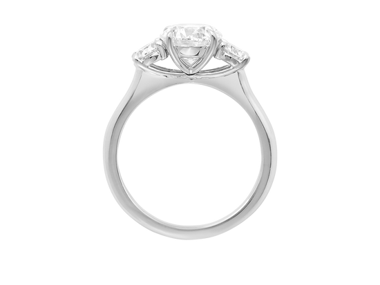 A.G round brilliant cut diamond trilogy four claw setting and half round band in silver. 