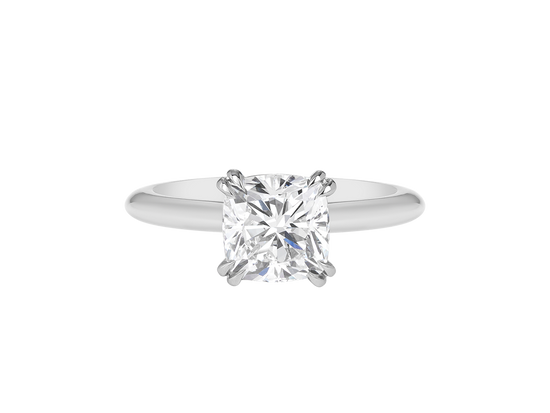 A.G cushion cut solitaire double claw setting with half round band. 