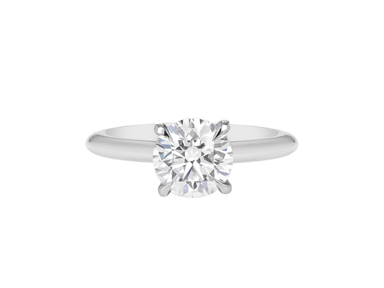 A.G round brilliant cut diamond four claw setting with a half round band.