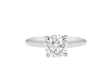 A.G round brilliant cut diamond four claw setting with a half round band.