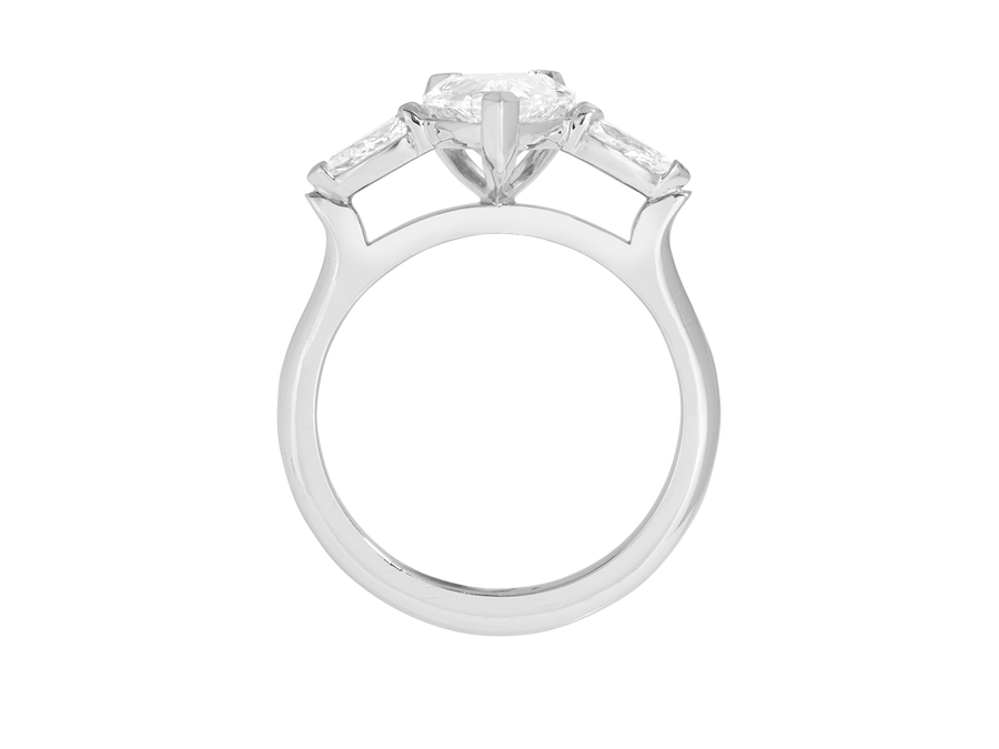 Front view of A.G pear cut diamond with pear cut side diamonds in a half round band.