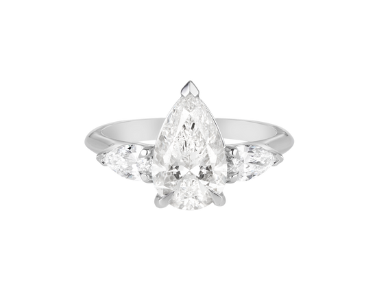 A.G pear cut diamond with pear cut side diamonds in a half round band.
