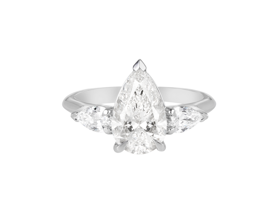 A.G pear cut diamond with pear cut side diamonds in a half round band.