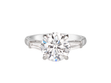 A.G round brilliant cut and tapered baguette diamond trilogy engagement ring. 