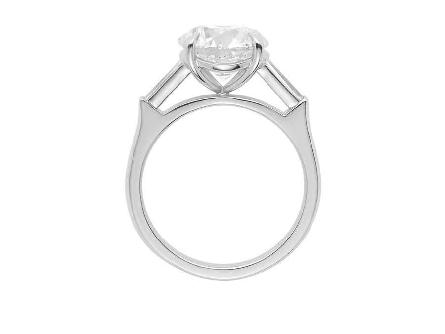 Front view of A.G round brilliant cut and tapered baguette diamond trilogy engagement ring. 