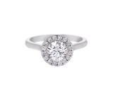 A.G round brilliant cut diamond halo setting with half round band.