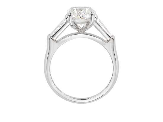 A.G oval cut and tapered baguette diamond engagement ring. 