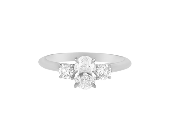 A.G oval cut and round brilliant cut diamond trilogy ring.