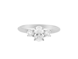 A.G oval cut and round brilliant cut diamond trilogy ring.