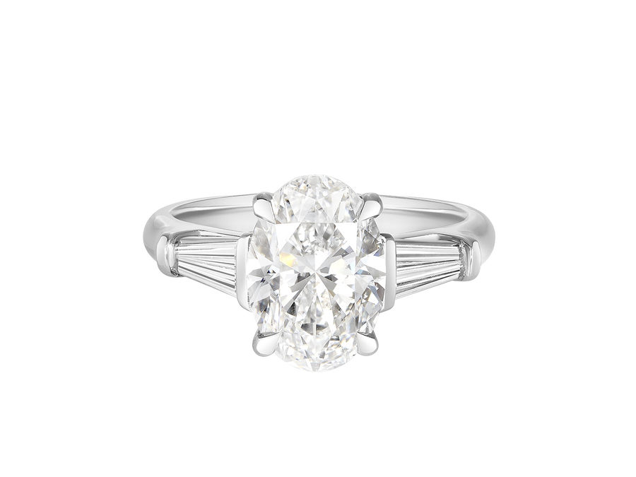 A.G oval cut and tapered baguette diamond engagement ring. 
