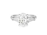 A.G oval cut and tapered baguette diamond engagement ring. 