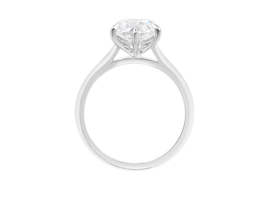 Front view of A.G round brilliant cut diamond six claw setting with swept up shoulders and a half round band. 