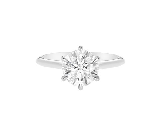 A.G round brilliant cut diamond six claw setting with swept up shoulders and a half round band. 