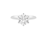 A.G round brilliant cut diamond six claw setting with swept up shoulders and a half round band. 